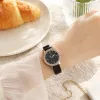 A rose gold diamond-encrusted bezel and black leather strap ladies' watch details Picture